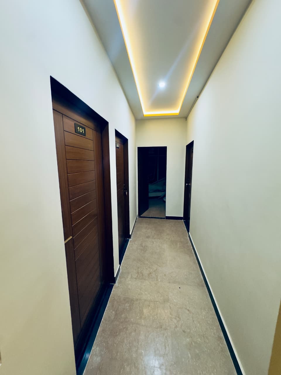 Premium Corridor with Golden LED Lighting — Chakwal Guest House